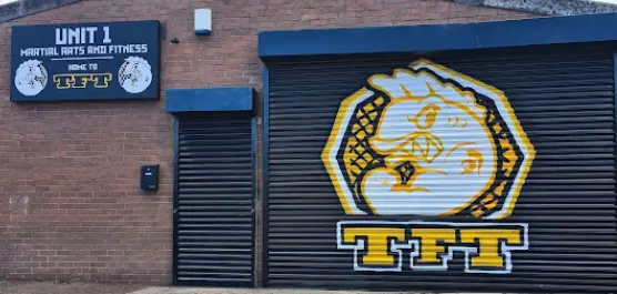 Front of TFT MMA with the fish logo on the shutter